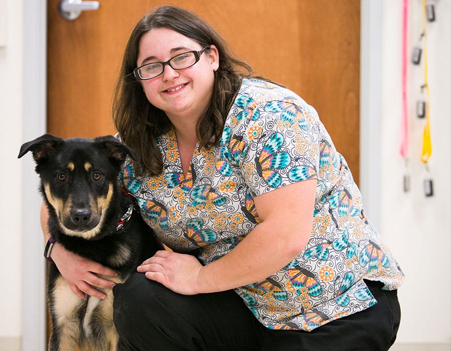 woman-holding-dog Pet Wellness Care in Ukiah: Veterinarian Hugs Dog